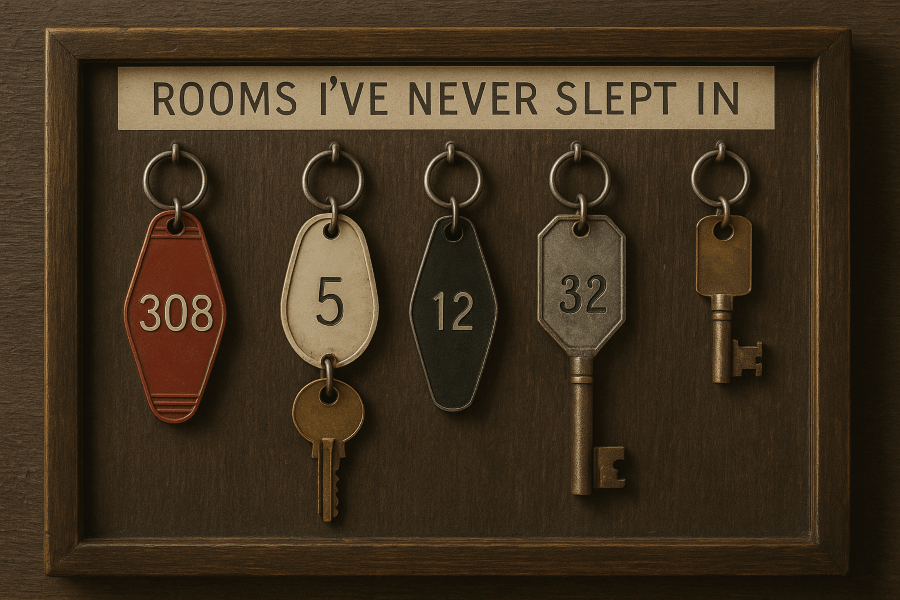 Wooden board with vintage motel keys labeled “Rooms I’ve Never Slept In”