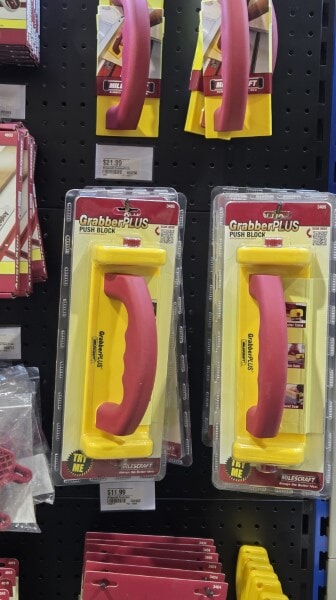 Milescraft GrabberPLUS push blocks displayed on a pegboard wall at Woodcraft.