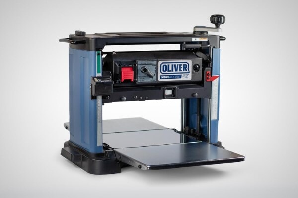 Oliver 10045 13-inch benchtop planer with folding tables extended.