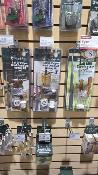 Woodturning project kits displayed at Woodcraft, including salt and pepper grinder kits and pen turning supplies.