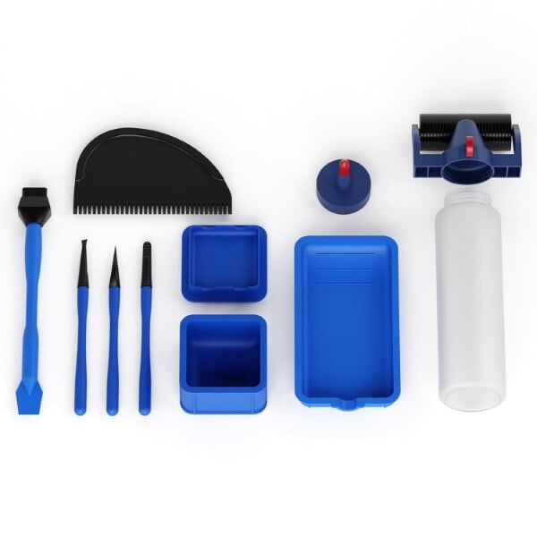 Rockler silicone glue applicator kit with brushes, trays, spreaders, bottle, and accessories arranged neatly on a white background.